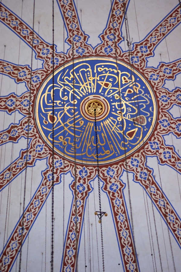 The central boss in the main dome is surrounding by a design based on an Arabic text
