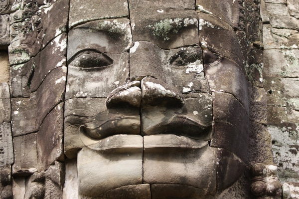 Close up of the details of a smiling Buddha-King face