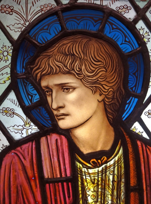 Close up of stained glass head of St Paul designed by Edward Burne-Jones