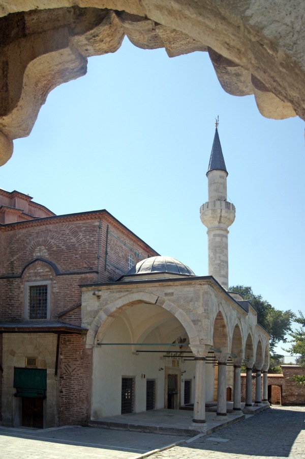 The single minaret and the entrance to Kucukayasofya Mosque in Istanbul